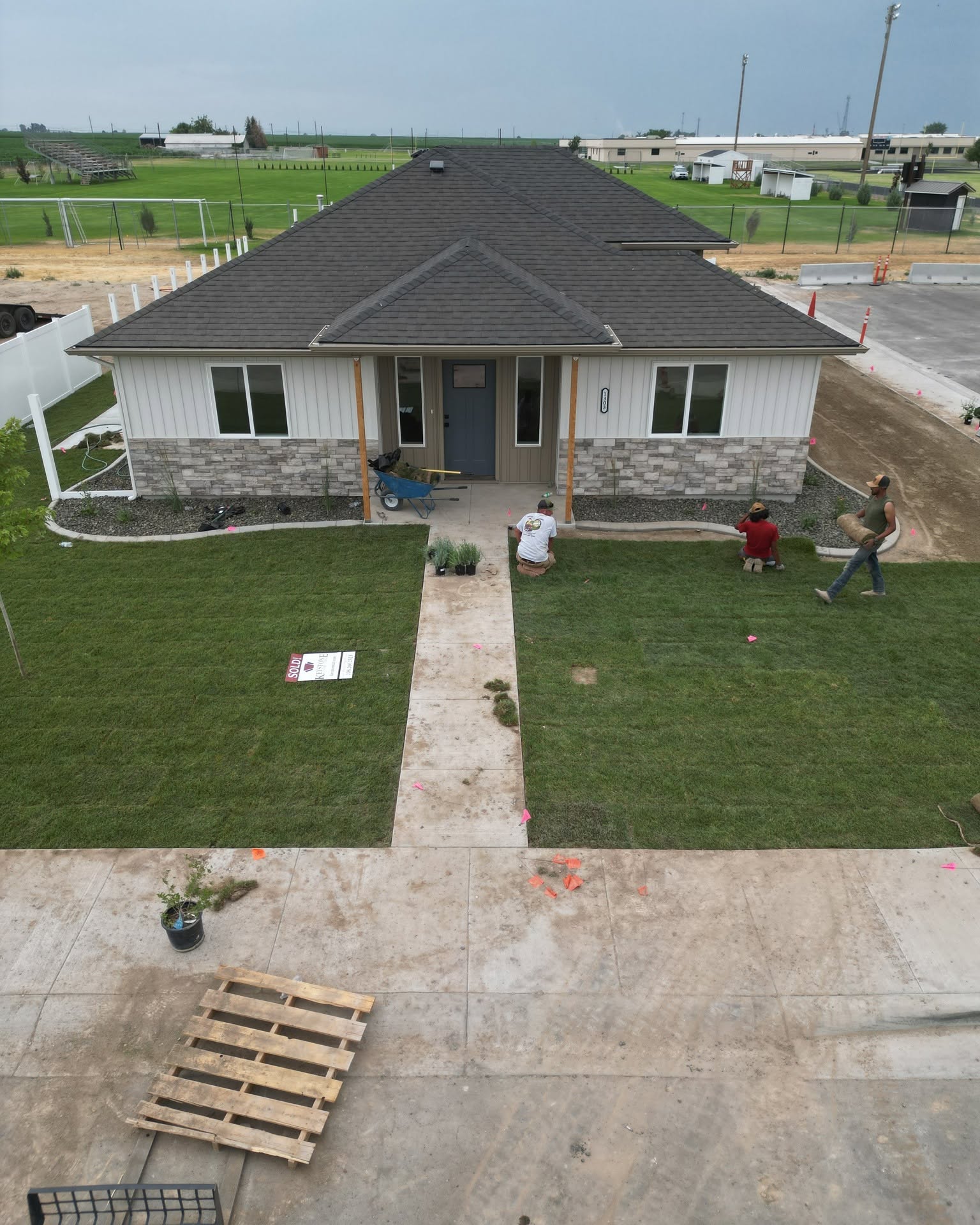 Hanks crew installing fresh sod in the front yard of a newly built home