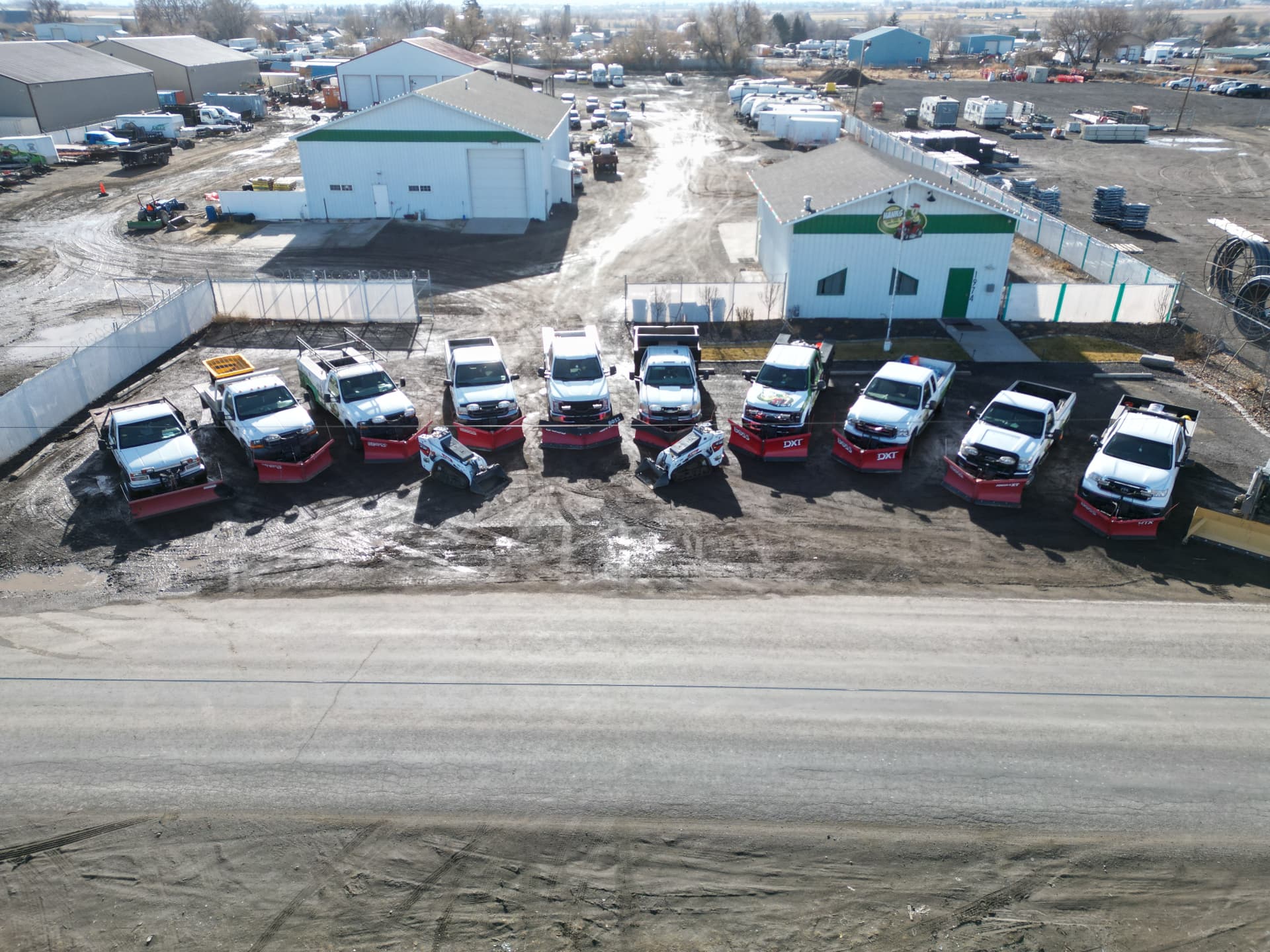 Aerial view of the Hanks snow removal fleet lined up at the yard