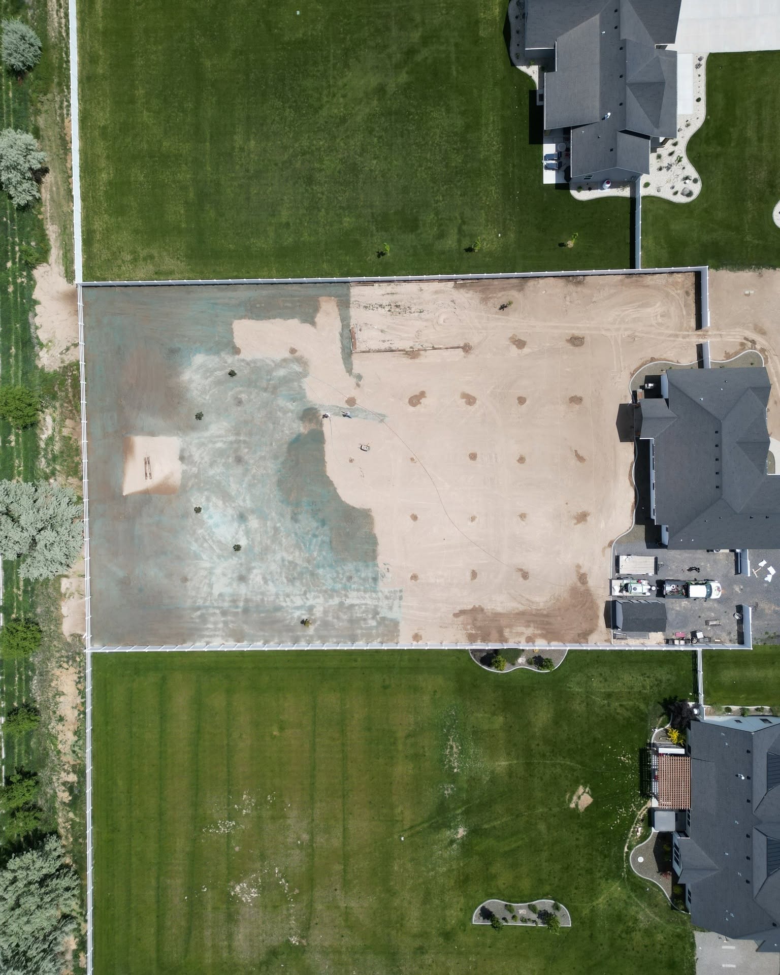 Aerial view of residential properties and landscaping work in the Magic Valley