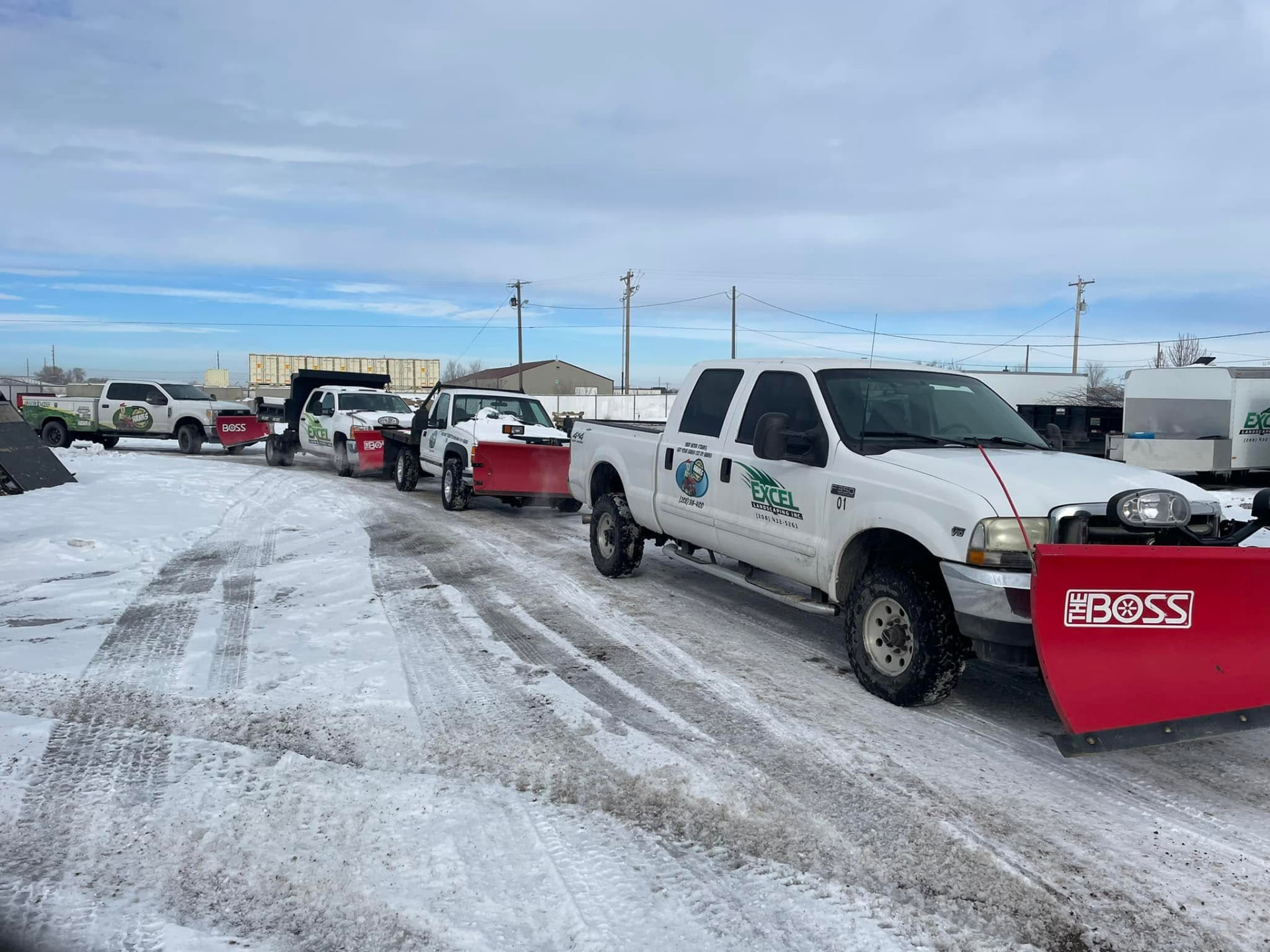 Fleet of Hanks snow plow trucks lined up and ready for service