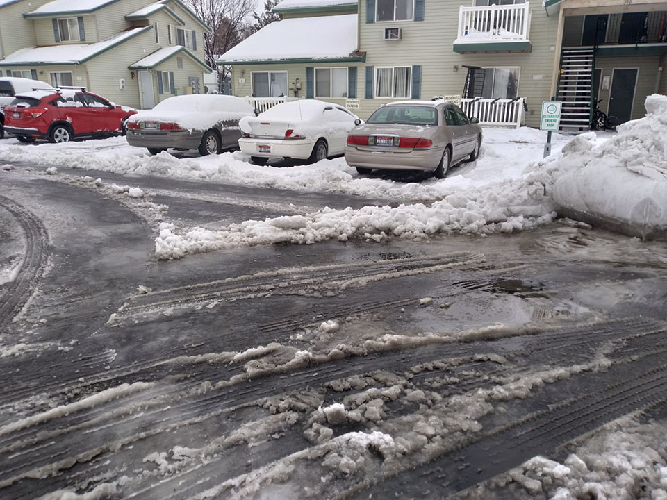 Cleared apartment complex parking lot after snowfall