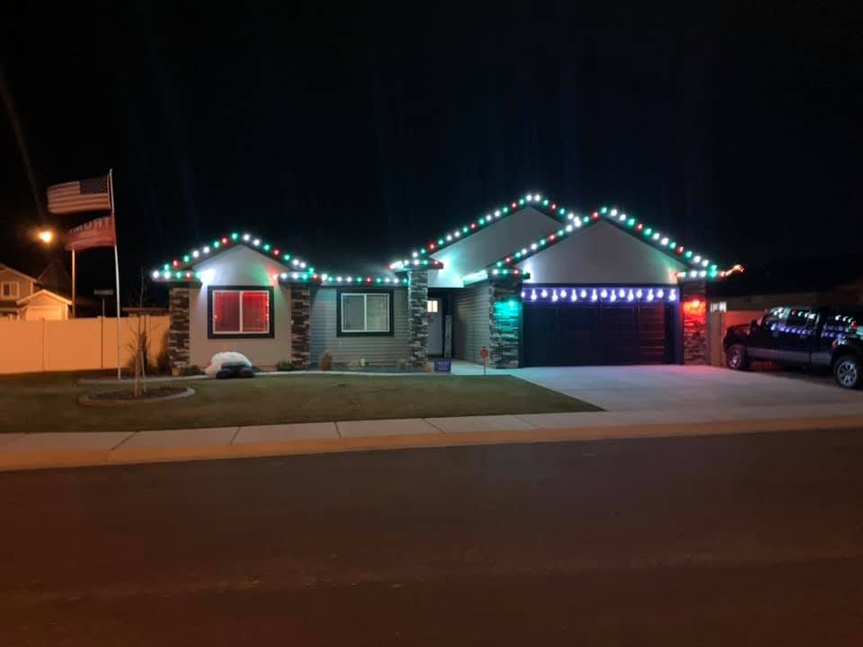 Home decorated with red, green and blue custom color Christmas lights